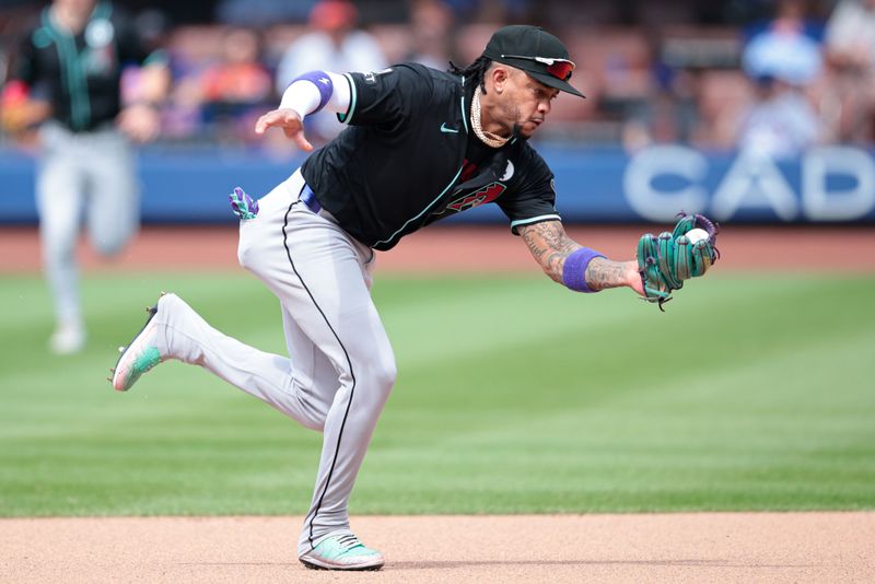 Jun 2, 2024; New York City, New York, USA; Arizona Diamondbacks second baseman Ketel Marte (4) fields the ball during the sixth inning against the New York Mets at Citi Field. Mandatory Credit: Vincent Carchietta-USA TODAY Sports