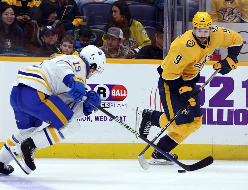 Mar 7, 2024; Nashville, Tennessee, USA; Nashville Predators left wing Filip Forsberg (9) competes for the puck with Buffalo Sabres center Peyton Krebs (19) at Bridgestone Arena. Mandatory Credit: Alan Poizner-USA TODAY Sports