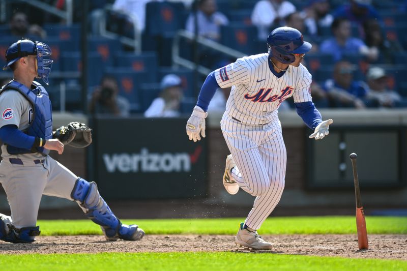 May 2, 2024; New York City, New York, USA; New York Mets shortstop Francisco Lindor (12) hits a two RBI walk off single against the Chicago Cubs during the eleventh inning at Citi Field. Mandatory Credit: John Jones-USA TODAY Sports