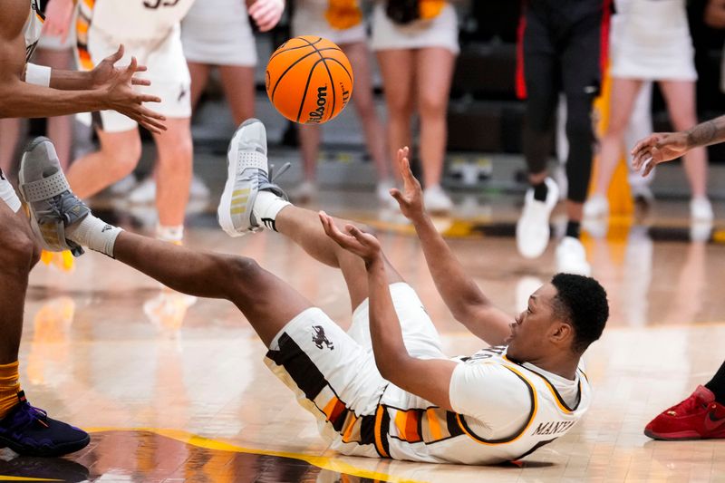 Feb 27, 2024; Laramie, Wyoming, USA; Wyoming Cowboys forward Cam Manyawu (5) saves a loose ball against the UNLV Runnin' Rebels during the second half at Arena-Auditorium. Mandatory Credit: Troy Babbitt-USA TODAY Sports