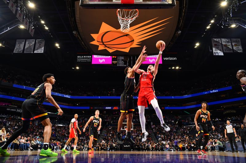 PHOENIX, AZ - FEBRUARY 28: Karlo Matkovic #17 of the New Orleans Pelicans shoots the ball during the game against the Phoenix Suns on February 28, 2025 at PHX Arena in Phoenix, Arizona. NOTE TO USER: User expressly acknowledges and agrees that, by downloading and or using this photograph, user is consenting to the terms and conditions of the Getty Images License Agreement. Mandatory Copyright Notice: Copyright 2025 NBAE (Photo by Barry Gossage/NBAE via Getty Images)