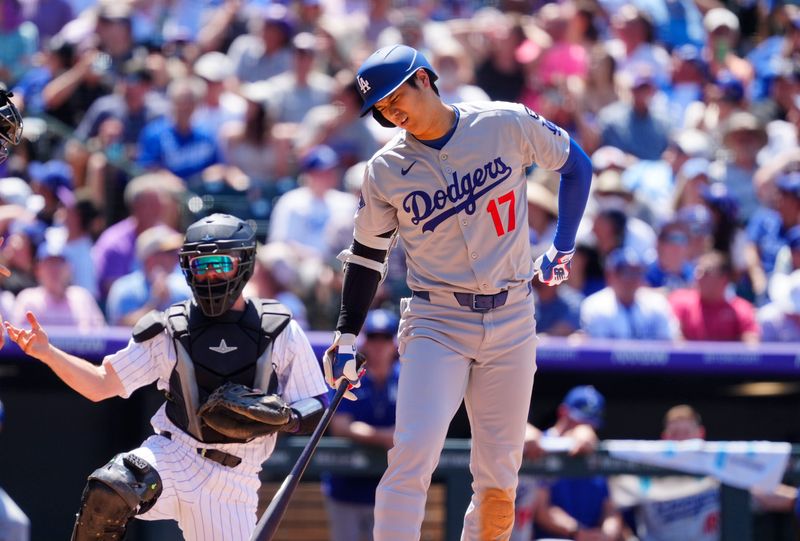 Jun 26, 2025; Denver, Colorado, USA; Los Angeles Dodgers designated hitter  Shohei Ohtani (17) reacts after swinging the bat in the seventh inning against the Colorado Rockies at Coors Field. Mandatory Credit: Ron Chenoy-Imagn Images