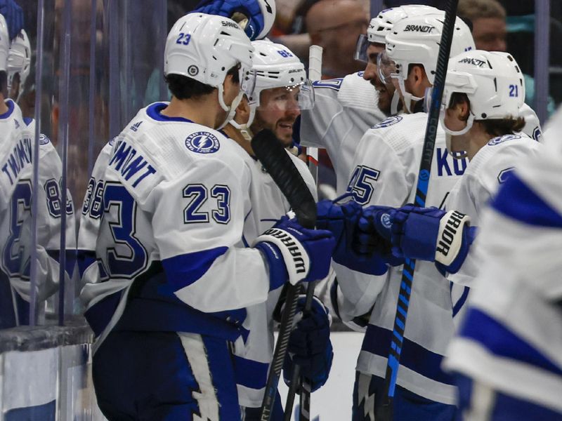 Dec 9, 2023; Seattle, Washington, USA; Tampa Bay Lightning right wing Nikita Kucherov (86, second from left), celebrates with teammates after scoring a goal against the Seattle Kraken during overtime at Climate Pledge Arena. Mandatory Credit: Joe Nicholson-USA TODAY Sports