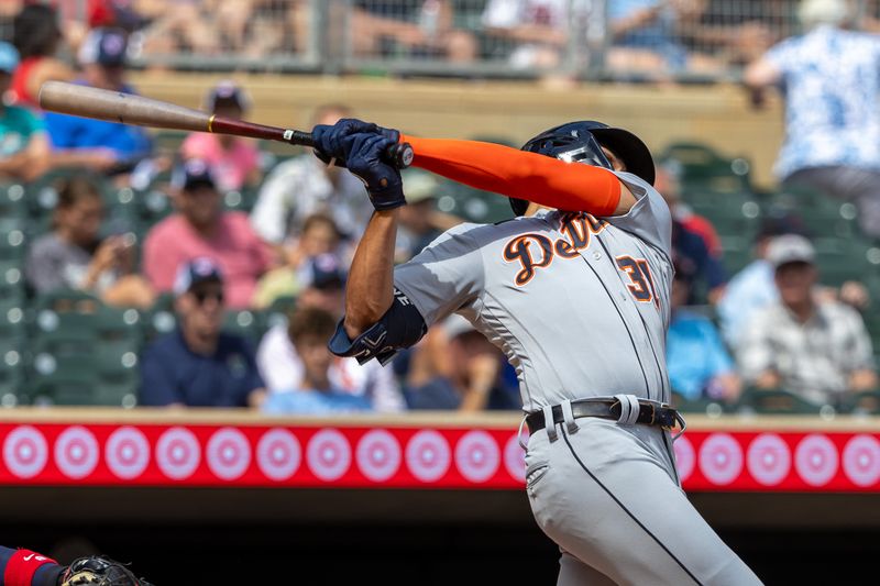 Aug 16, 2023; Minneapolis, Minnesota, USA; Detroit Tigers center fielder Riley Greene (31) hits a single against the Minnesota Twins in the fifth inning at Target Field. Mandatory Credit: Jesse Johnson-USA TODAY Sports