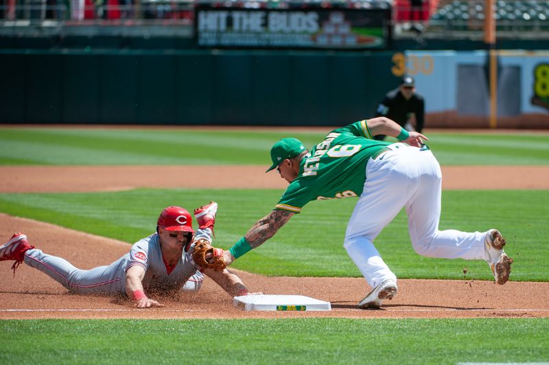 Apr 29, 2023; Oakland, California, USA; Oakland Athletics third baseman Jace Peterson (6) tags out Cincinnati Reds first baseman Spencer Steer (7) at third base during the first inning at RingCentral Coliseum. Mandatory Credit: Ed Szczepanski-USA TODAY Sports