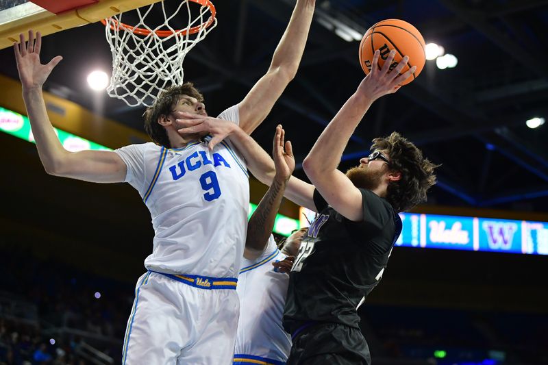 January 14, 2024; Los Angeles, California, USA; Washington Huskies forward Wilhelm Breidenbach (32) moves to the basket against UCLA Bruins forward Berke Buyuktuncel (9) during the first half at Pauley Pavilion. Mandatory Credit: Gary A. Vasquez-USA TODAY Sports