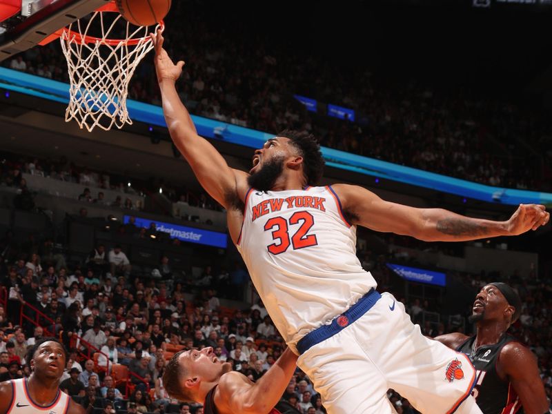 MIAMI, FL - OCTOBER 30: Karl-Anthony Towns #32 of the New York Knicks goes up for the rebound during the game against the Miami Heat on October 30, 2024 at Kaseya Center in Miami, Florida. NOTE TO USER: User expressly acknowledges and agrees that, by downloading and or using this Photograph, user is consenting to the terms and conditions of the Getty Images License Agreement. Mandatory Copyright Notice: Copyright 2024 NBAE (Photo by Issac Baldizon/NBAE via Getty Images)