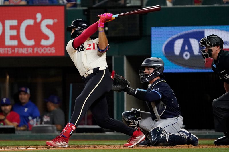 Jul 5, 2024; Arlington, Texas, USA; Texas Rangers third baseman Jonathan Ornelas (21) singles during the third inning against the Tampa Bay Rays at Globe Life Field. Mandatory Credit: Raymond Carlin III-USA TODAY Sports
