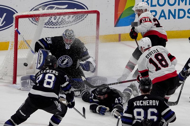 Feb 19, 2024; Tampa, Florida, USA; Ottawa Senators center Tim Stutzle (18) scores a goal against the Tampa Bay Lightning during the first period at Amalie Arena. Mandatory Credit: Dave Nelson-USA TODAY Sports