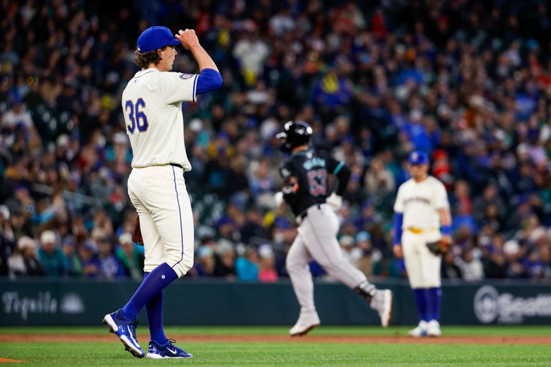 Apr 28, 2024; Seattle, Washington, USA; Seattle Mariners starting pitcher Logan Gilbert (36) walks around the mound after surrendering a solo-home run to Arizona Diamondbacks first baseman Christian Walker (53) during the second inning at T-Mobile Park. Mandatory Credit: Joe Nicholson-USA TODAY Sports