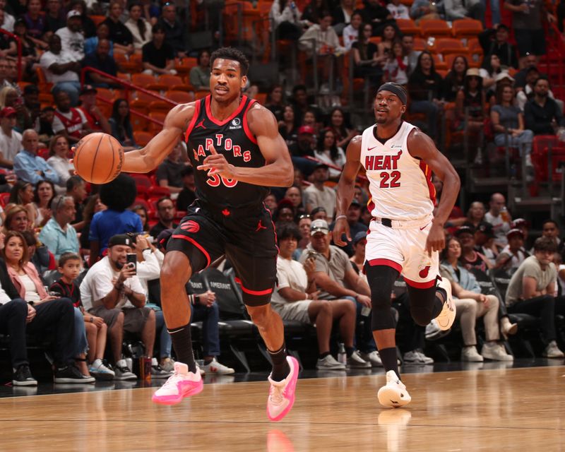 MIAMI, FL - APRIL 14:  Ochai Agbaji #30 of the Toronto Raptors handles the ball during the game  on April 14, 2024 at Kaseya Center in Miami, Florida. NOTE TO USER: User expressly acknowledges and agrees that, by downloading and or using this Photograph, user is consenting to the terms and conditions of the Getty Images License Agreement. Mandatory Copyright Notice: Copyright 2024 NBAE (Photo by Issac Baldizon/NBAE via Getty Images)