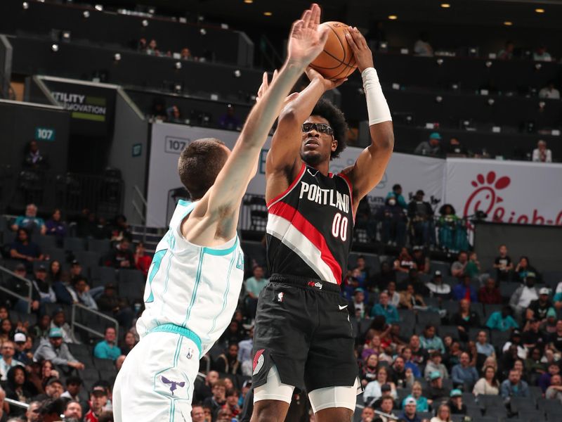 CHARLOTTE, NC - APRIL 3: Scoot Henderson #00 of the Portland Trail Blazers shoots a 3-point basket during the game  on April 3, 2024 at Spectrum Center in Charlotte, North Carolina. NOTE TO USER: User expressly acknowledges and agrees that, by downloading and or using this photograph, User is consenting to the terms and conditions of the Getty Images License Agreement. Mandatory Copyright Notice: Copyright 2024 NBAE (Photo by Kent Smith/NBAE via Getty Images)