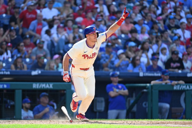 Sep 15, 2024; Philadelphia, Pennsylvania, Philadelphia Phillies catcher J.T. Realmuto (10) hits a walk-off RBI single during the ninth inning against the New York Mets USA; at Citizens Bank Park. Mandatory Credit: Eric Hartline-Imagn Images