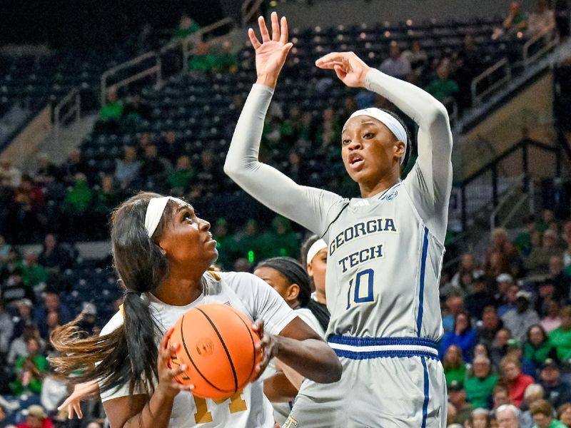 Feb 23, 2023; South Bend, Indiana, USA; Notre Dame Fighting Irish guard KK Bransford (14) looks to shoot as Georgia Tech Yellow Jackets guard Bianca Jackson (10) defends in the second half at the Purcell Pavilion. Mandatory Credit: Matt Cashore-USA TODAY Sports