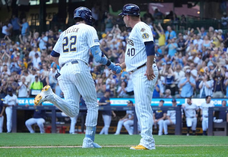Jun 29, 2025; Milwaukee, Wisconsin, USAt thMilwaukee Brewers outfielder Christian Yelich (22) is congratulated by Milwaukee Brewers third base coach Jason Lane (40) after hitting a home run againstt the Colorado Rockies in sixth inning that American Family Field. Mandatory Credit: Michael McLoone-Imagn Images