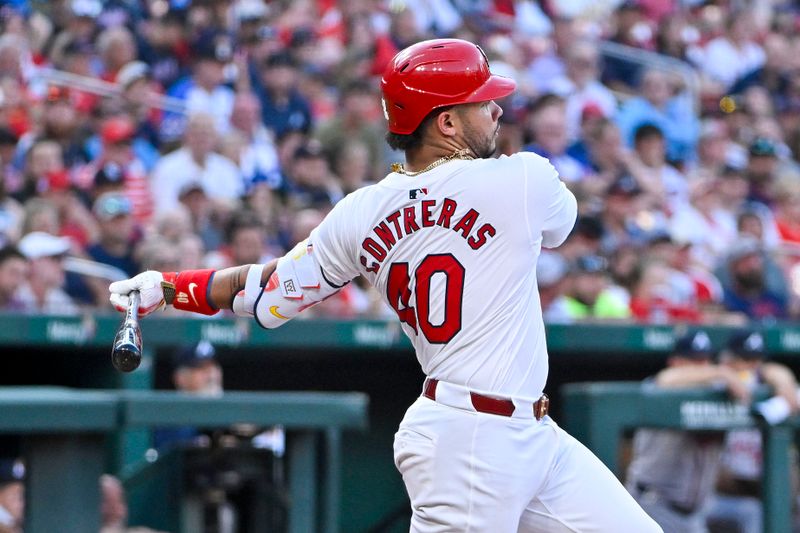 Jun 24, 2024; St. Louis, Missouri, USA;  St. Louis Cardinals catcher Willson Contreras (40) hits a one run single against the Atlanta Braves during the third inning at Busch Stadium. Mandatory Credit: Jeff Curry-USA TODAY Sports