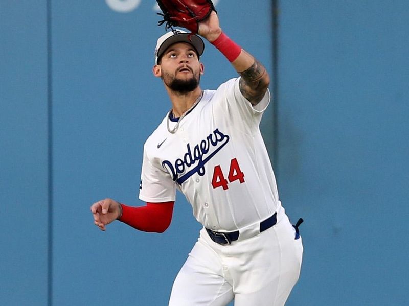 Jul 4, 2024; Los Angeles, California, USA; Los Angeles Dodgers outfielder Andy Pages (44) makes a catch during the fifth inning against the Arizona Diamondbacks at Dodger Stadium. Mandatory Credit: Jason Parkhurst-USA TODAY Sports