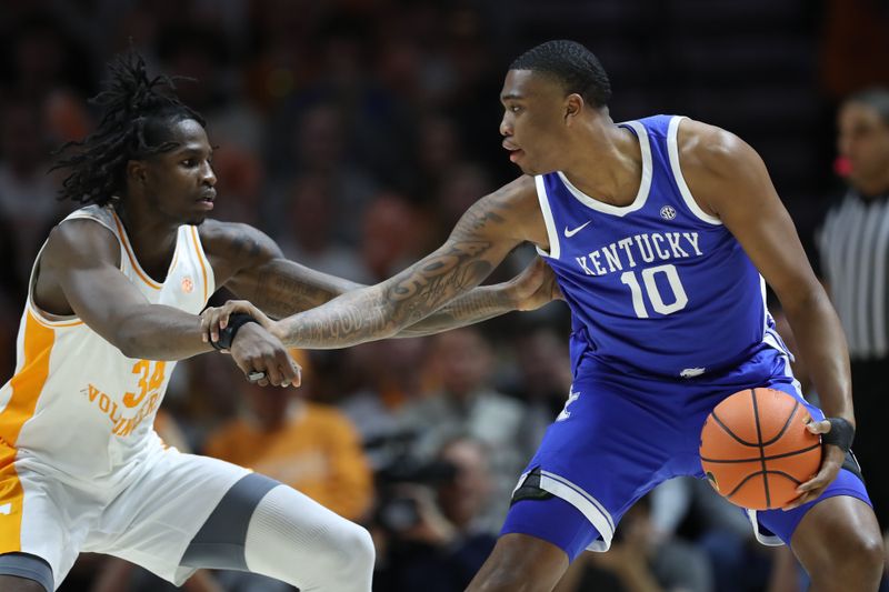 Jan 28, 2025; Knoxville, Tennessee, USA; Tennessee Volunteers forward Felix Okpara (34) defends Kentucky Wildcats forward Brandon Garrison (10) during the first half at Thompson-Boling Arena at Food City Center. Mandatory Credit: Randy Sartin-Imagn Images