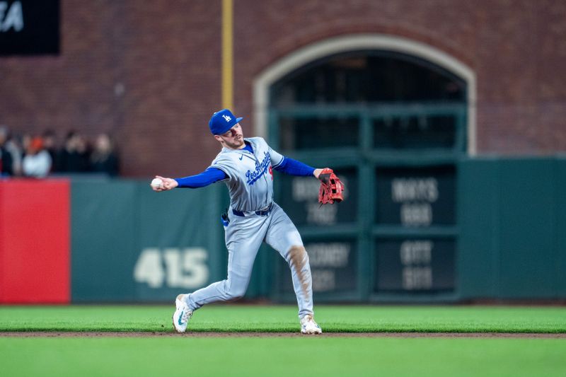 May 13, 2024; San Francisco, California, USA; Los Angeles Dodgers second baseman Gavin Lux (9) throws out San Francisco Giants second baseman Thairo Estrada (not pictured) during the sixth inning at Oracle Park. Mandatory Credit: Neville E. Guard-USA TODAY Sports