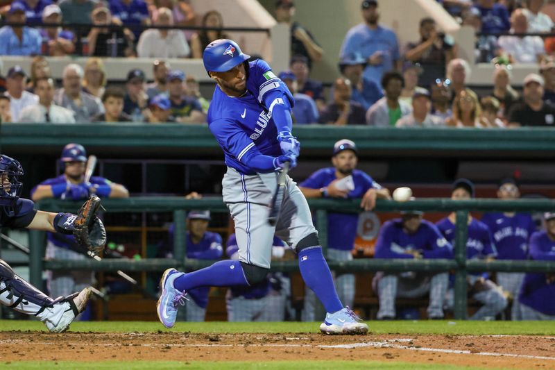 Mar 7, 2024; Lakeland, Florida, USA; Toronto Blue Jays right fielder George Springer (4) bats during the third inning against the Detroit Tigers at Publix Field at Joker Marchant Stadium. Mandatory Credit: Mike Watters-USA TODAY Sports