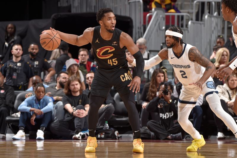 CLEVELAND, OH - APRIL 10: Donovan Mitchell #45 of the Cleveland Cavaliers dribbles the ball during the game against the Memphis Grizzlies on April 10, 2024 at Rocket Mortgage FieldHouse in Cleveland, Ohio. NOTE TO USER: User expressly acknowledges and agrees that, by downloading and/or using this Photograph, user is consenting to the terms and conditions of the Getty Images License Agreement. Mandatory Copyright Notice: Copyright 2024 NBAE (Photo by David Liam Kyle/NBAE via Getty Images)