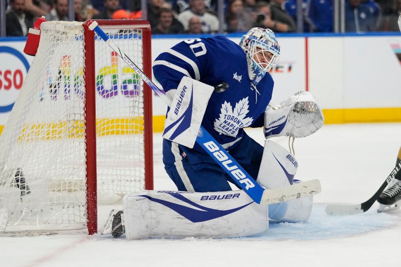 Nov 20, 2024; Toronto, Ontario, CAN; Toronto Maple Leafs goaltender Joseph Woll (60) makes a save against the Vegas Golden Knights during the second period at Scotiabank Arena. Mandatory Credit: John E. Sokolowski-Imagn Images