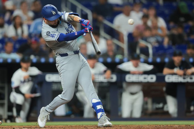 May 5, 2025; Miami, Florida, USA; Los Angeles Dodgers center fielder Andy Pages (44) hits a triple against the Miami Marlins during the eighth inning at loanDepot Park. Mandatory Credit: Sam Navarro-Imagn Images