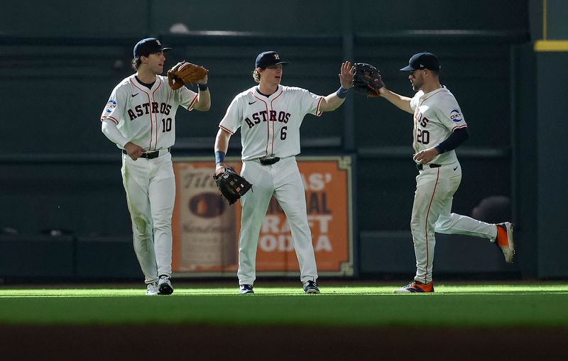 Jun 22, 2024; Houston, Texas, USA; Houston Astros left fielder Joey Loperfido (10) and center fielder Jake Meyers (6) and right fielder Chas McCormick (20) celebrate after the game against the Baltimore Orioles at Minute Maid Park. Mandatory Credit: Troy Taormina-USA TODAY Sports