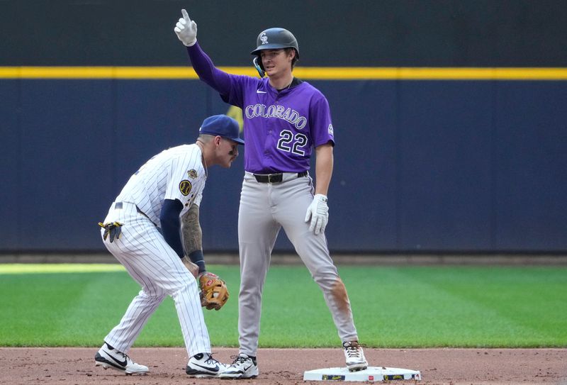 Jun 29, 2025; Milwaukee, Wisconsin, USA; Colorado Rockies outfielder Mickey Moniak (22) hits a double agains the Milwaukee Brewers in the second inning at American Family Field. Mandatory Credit: Michael McLoone-Imagn Images