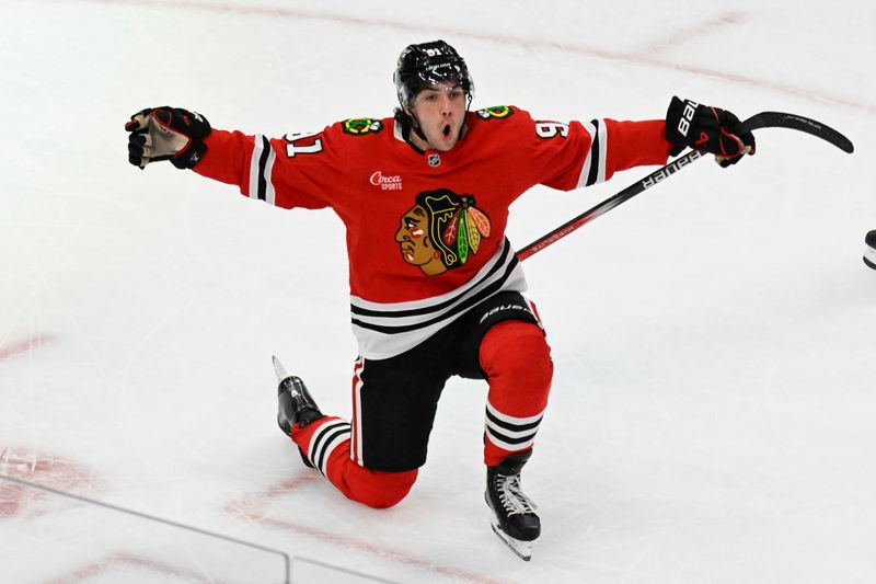 Apr 12, 2025; Chicago, Illinois, USA;  Chicago Blackhawks center Frank Nazar (91) celebrates after scoring a goal against the Winnipeg Jets during the third period at United Center. Mandatory Credit: Matt Marton-Imagn Images