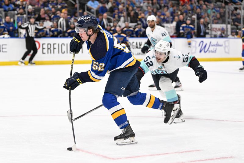 Apr 14, 2024; St. Louis, Missouri, USA; Seattle Kraken left wing Tye Kartye (52) attempts to block a shot from St. Louis Blues center Zach Dean (52) during the second period at Enterprise Center. Mandatory Credit: Jeff Le-USA TODAY Sports