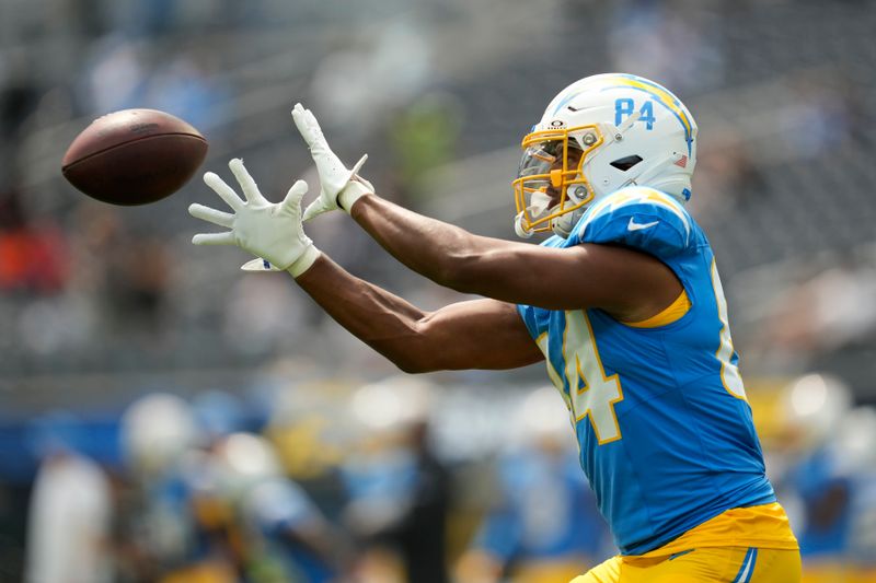 Los Angeles Chargers tight end Stone Smartt (84) warms up before an NFL football game against the Las Vegas Raiders, Sunday, Sept. 8, 2024, in Inglewood, Calif. (AP Photo/Ashley Landis)