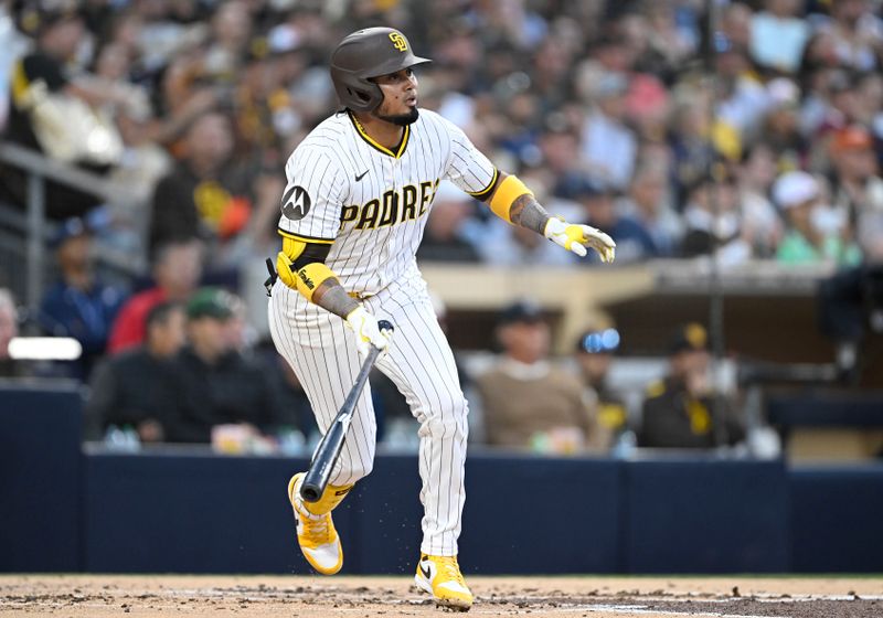 Apr 29, 2025; San Diego, California, USA; San Diego Padres first baseman Luis Arráez hits a single during the second inning against the San Francisco Giants at Petco Park. Mandatory Credit: Denis Poroy-Imagn Images