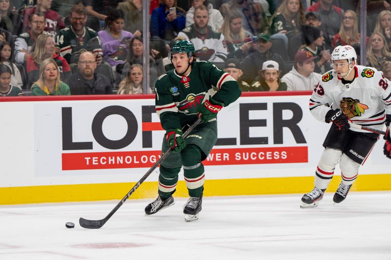 Oct 1, 2024; Saint Paul, Minnesota, USA; Minnesota Wild defenseman Brock Faber (7) skates toward the Chicago Blackhawks goal in the second period at Xcel Energy Center. Mandatory Credit: Matt Blewett-Imagn Images