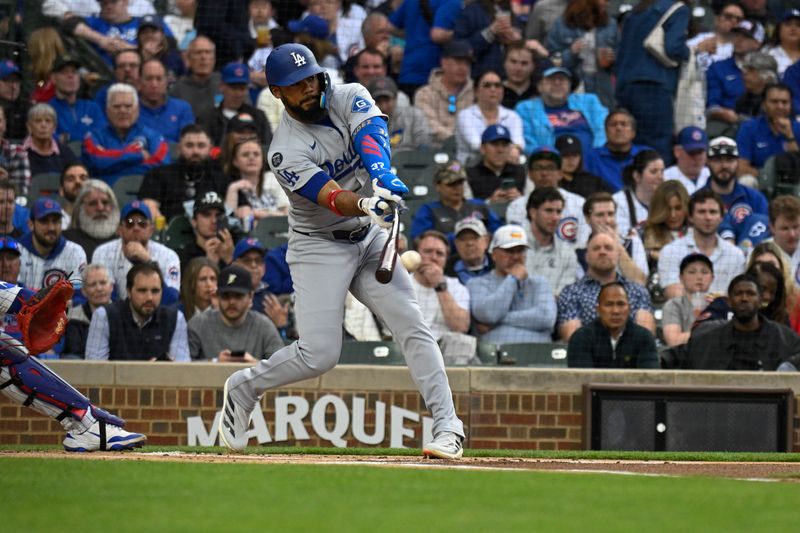 Apr 22, 2025; Chicago, Illinois, USA;  Los Angeles Dodgers outfielder Teoscar Hernández (37) singles against the Chicago Cubs during the first inning at Wrigley Field. Mandatory Credit: Matt Marton-Imagn Images