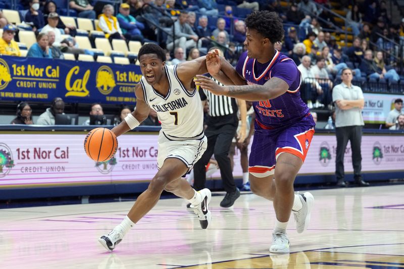 Dec 13, 2025; Berkeley, California, USA; California Golden Bears guard Dai Dai Ames (7) dribbles against Northwestern State Demons forward Kordrick Turner (right) during the first half at Haas Pavilion. Mandatory Credit: Darren Yamashita-Imagn Images