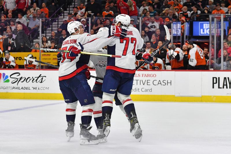 Apr 16, 2024; Philadelphia, Pennsylvania, USA; Washington Capitals right wing T.J. Oshie (77) celebrates his goal with defenseman John Carlson (74) and defenseman Martin Fehervary (42) against the Philadelphia Flyers during the third period at Wells Fargo Center. Mandatory Credit: Eric Hartline-USA TODAY Sports