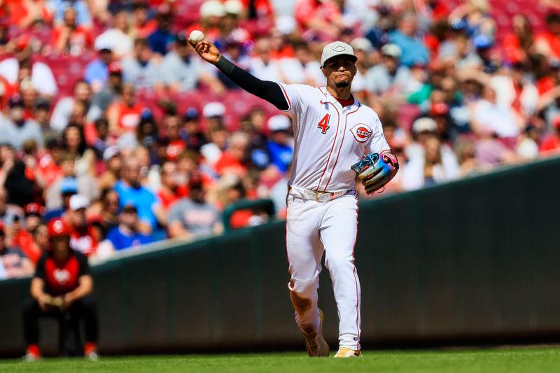 May 18, 2025; Cincinnati, Ohio, USA; Cincinnati Reds third baseman Santiago Espinal (4) throws to first to get Cleveland Guardians designated hitter Jose Ramirez (not pictured) out in the seventh inning at Great American Ball Park. Mandatory Credit: Katie Stratman-Imagn Images