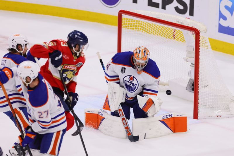 Jun 24, 2024; Sunrise, Florida, USA; Florida Panthers forward Carter Verhaeghe (23) watches as forward Sam Reinhart (13) (not pictured) scores against Edmonton Oilers goaltender Skinner Stuart (74) during the second period in game seven of the 2024 Stanley Cup Final at Amerant Bank Arena. Mandatory Credit: Sam Navarro-USA TODAY Sports