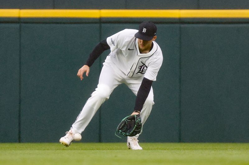 Sep 28, 2024; Detroit, Michigan, USA; Detroit Tigers outfielder Parker Meadows (22) fields a ground ball against the Chicago White Sox in the fifth inning of the game at Comerica Park. Mandatory Credit: Brian Bradshaw Sevald-Imagn Images