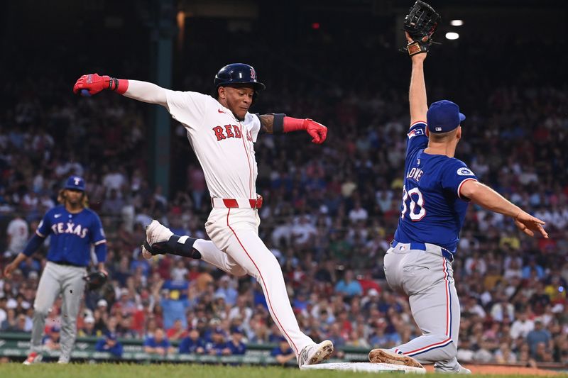 Aug 13, 2024; Boston, Massachusetts, USA; Boston Red Sox center fielder Ceddanne Rafaela (43) is out at first against Texas Rangers first baseman Nathaniel Lowe (30) during the third inning at Fenway Park. Mandatory Credit: Eric Canha-USA TODAY Sports