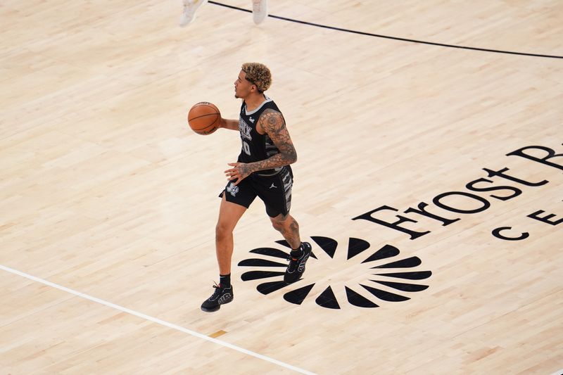 SAN ANTONIO, TX - MARCH 3: Jeremy Sochan #10 of the San Antonio Spurs dribbles the ball during the game against the Indiana Pacers on March 3, 2024 at the AT&T Center in San Antonio, Texas. NOTE TO USER: User expressly acknowledges and agrees that, by downloading and or using this photograph, user is consenting to the terms and conditions of the Getty Images License Agreement. Mandatory Copyright Notice: Copyright 2024 NBAE (Photos by Cooper Neill/NBAE via Getty Images)