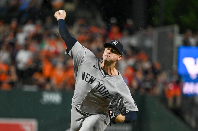 Jul 12, 2024; Baltimore, Maryland, USA;  New York Yankees pitcher Clay Holmes (35) delivers a ninth inning pitch against the Baltimore Orioles at Oriole Park at Camden Yards. Mandatory Credit: Tommy Gilligan-USA TODAY Sports