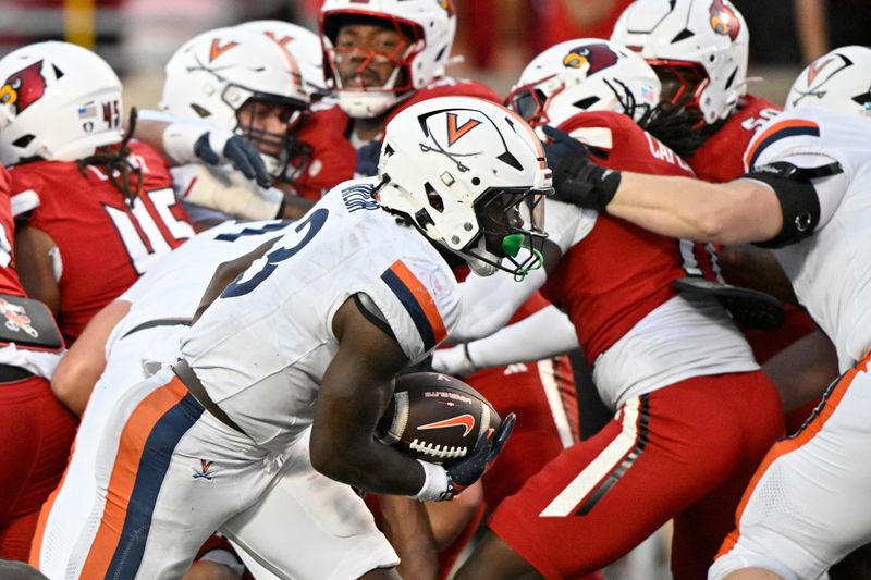 Oct 4, 2025; Louisville, Kentucky, USA; Virginia Cavaliers running back J'Mari Taylor (3) runs the ball in for a touchdown during the overtime against the Louisville Cardinals at L&N Federal Credit Union Stadium. Virginia defeated Louisville 30-27. Mandatory Credit: Jamie Rhodes-Imagn Images