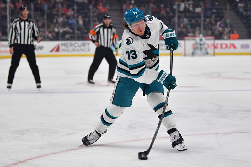 Apr 1, 2025; Anaheim, California, USA; San Jose Sharks center Tyler Toffoli (73) shoots on goal against the Anaheim Ducks during the first period at Honda Center. Mandatory Credit: Gary A. Vasquez-Imagn Images