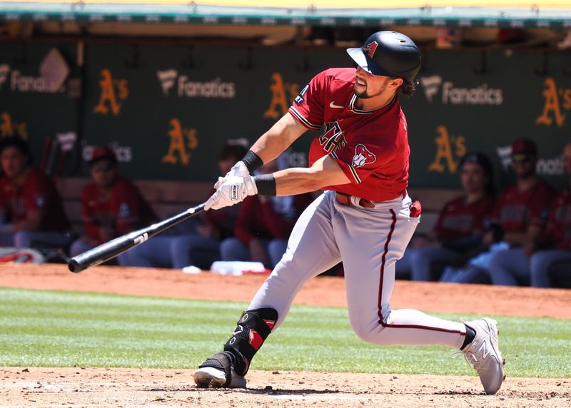 May 17, 2023; Oakland, California, USA; Arizona Diamondbacks center fielder Dominic Fletcher (8) hits a double against the Oakland Athletics during the fifth inning at Oakland-Alameda County Coliseum. Mandatory Credit: Kelley L Cox-USA TODAY Sports