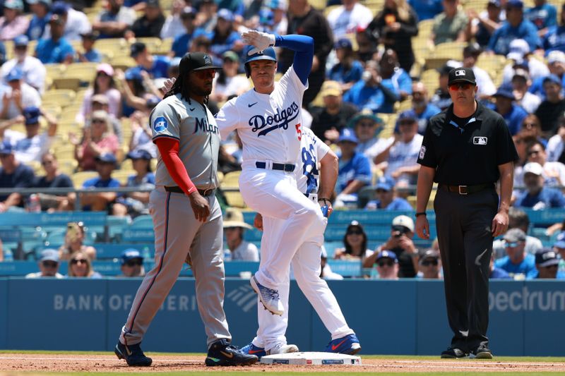 May 8, 2024; Los Angeles, California, USA;  Los Angeles Dodgers first base Freddie Freeman (5) reacts after hitting a single during the first inning against the Miami Marlins at Dodger Stadium. Mandatory Credit: Kiyoshi Mio-USA TODAY Sports