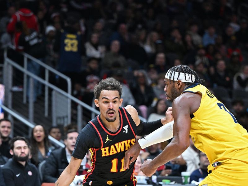 ATLANTA, GA - JANUARY 12: Trae Young #11 of the Atlanta Hawks dribbles the ball during the game against the Indiana Pacers on January 12, 2024 at State Farm Arena in Atlanta, Georgia.  NOTE TO USER: User expressly acknowledges and agrees that, by downloading and/or using this Photograph, user is consenting to the terms and conditions of the Getty Images License Agreement. Mandatory Copyright Notice: Copyright 2024 NBAE (Photo by Adam Hagy/NBAE via Getty Images)