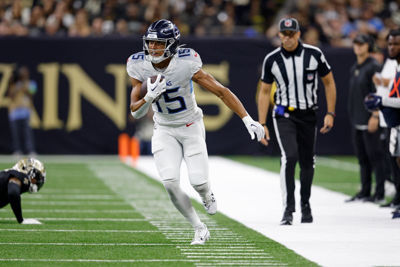 Tennessee Titans wide receiver Nick Westbrook-Ikhine (15) runs the ball during an NFL football game against the New Orleans Saints, Sunday, Sep. 10, 2023, in New Orleans. (AP Photo/Tyler Kaufman)