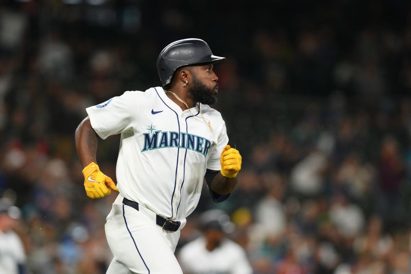 Sep 12, 2024; Seattle, Washington, USA; Seattle Mariners left fielder Randy Arozarena (56) runs the bases after hitting a 2-RBI single against the Texas Rangers during the fifth inning at T-Mobile Park. Mandatory Credit: Steven Bisig-Imagn Images